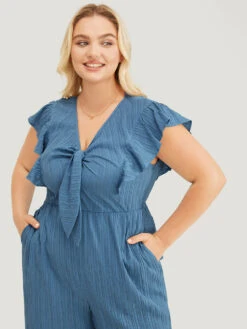 Solid Textured Ruffle Trim Cap Sleeve Pocket Knotted Jumpsuit -Bloomchic Shop 183708703 yl 884836ba 96a4 4b7a a890 160880b05af3
