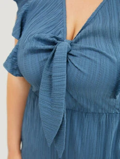 Solid Textured Ruffle Trim Cap Sleeve Pocket Knotted Jumpsuit -Bloomchic Shop 609859146 kb c3bfe24d ff96 4d6e bb6c 9c42ba449cdc